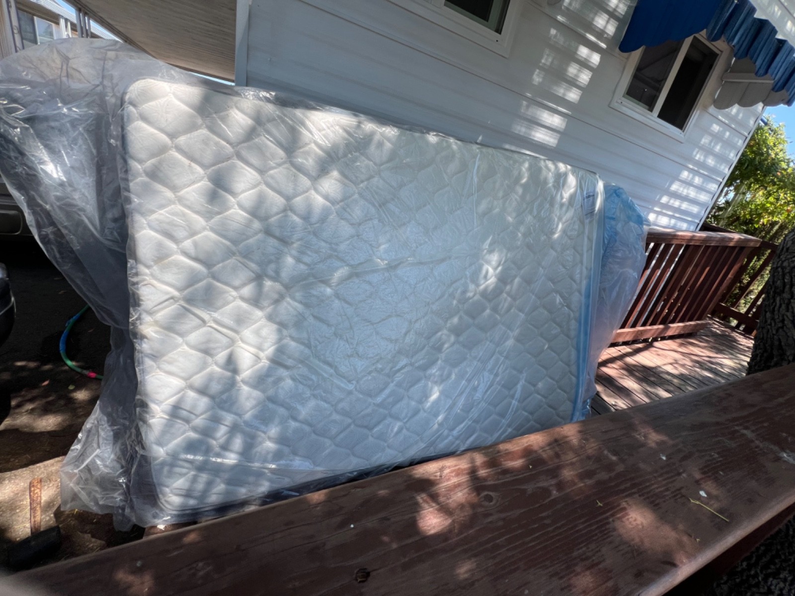 mattresses full size, white and has gray sides, brand new still in packaging.
