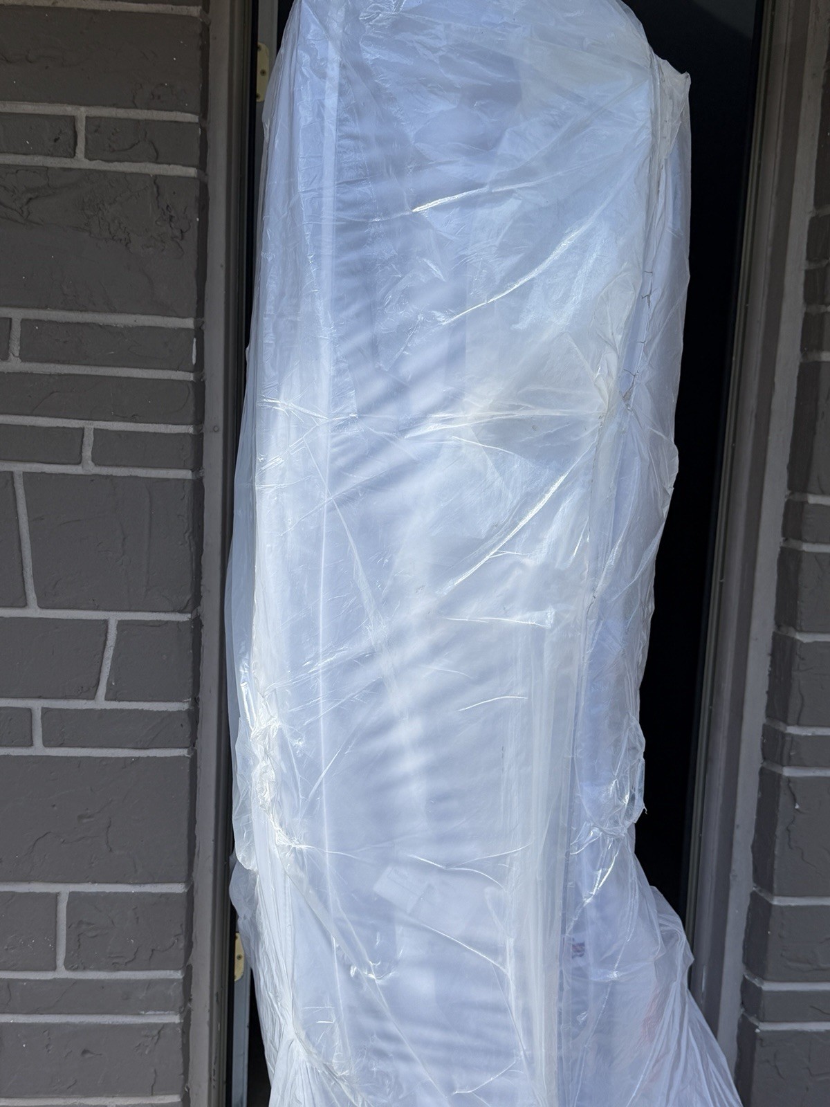 King White Mattress in Protective Plastic Cover for Bedroom