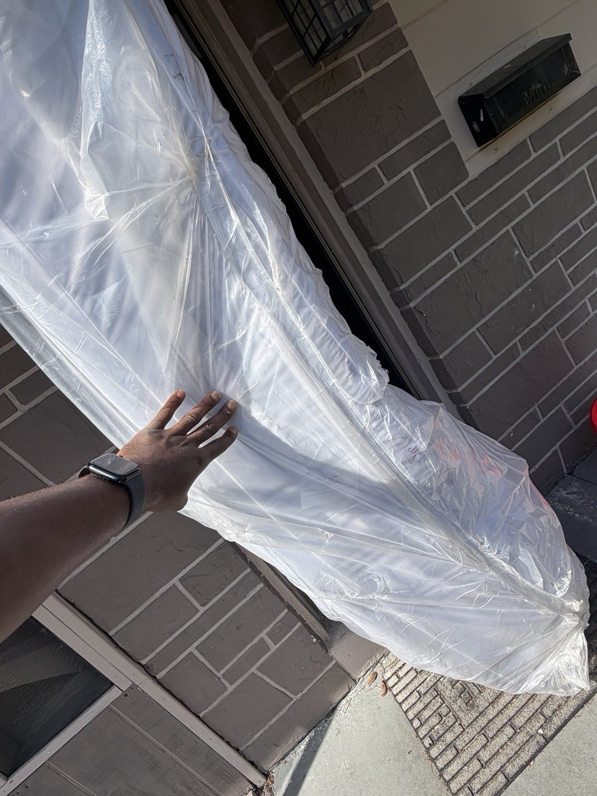 King White Mattress in Protective Plastic Cover for Bedroom